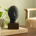 Sculpture visage calme noir